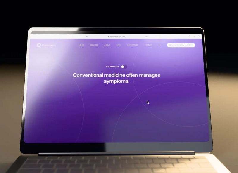 The Organic Well clinic website open on a laptop